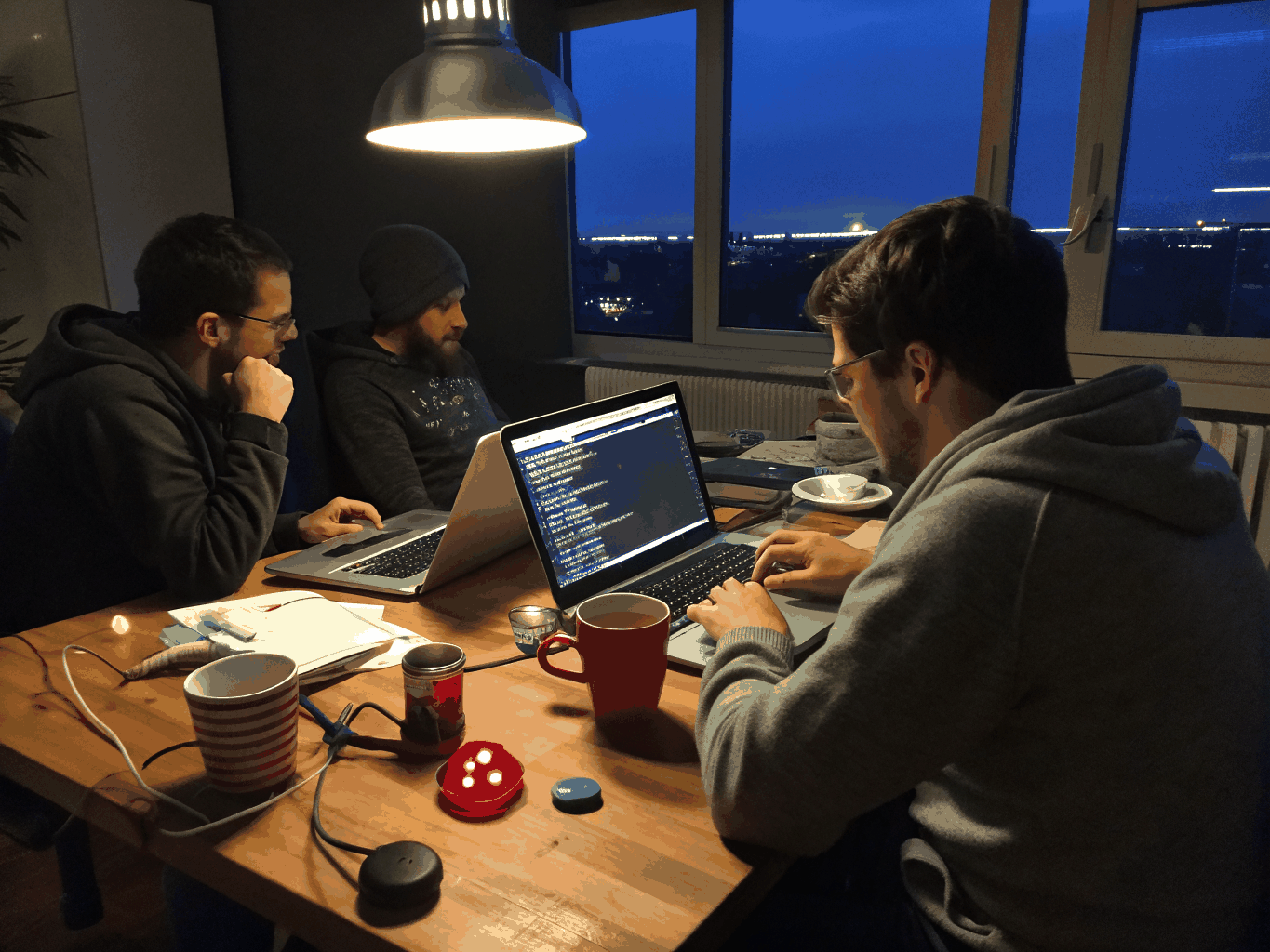High-contrast photo of a collaborative hackathon coding setup
